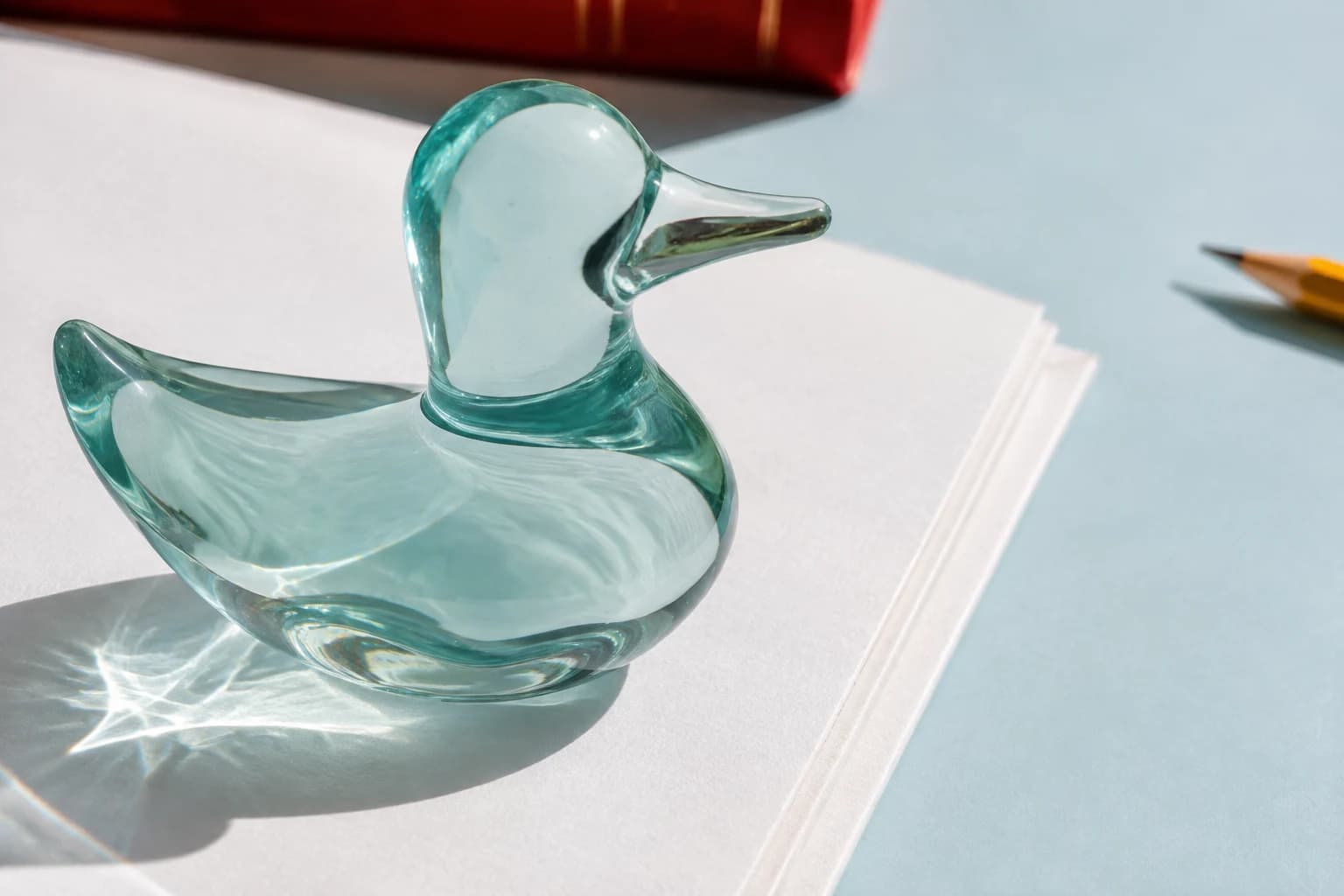 The Uniquack glass-duck desk object in daylight.
